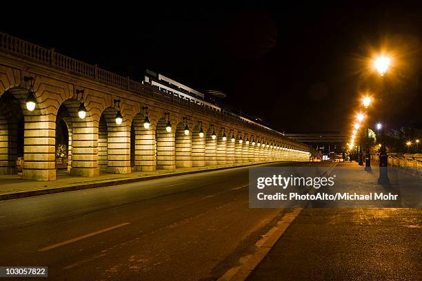 france, paris, street along the pont de bercy - night street stock pictures, royalty-free photos & images