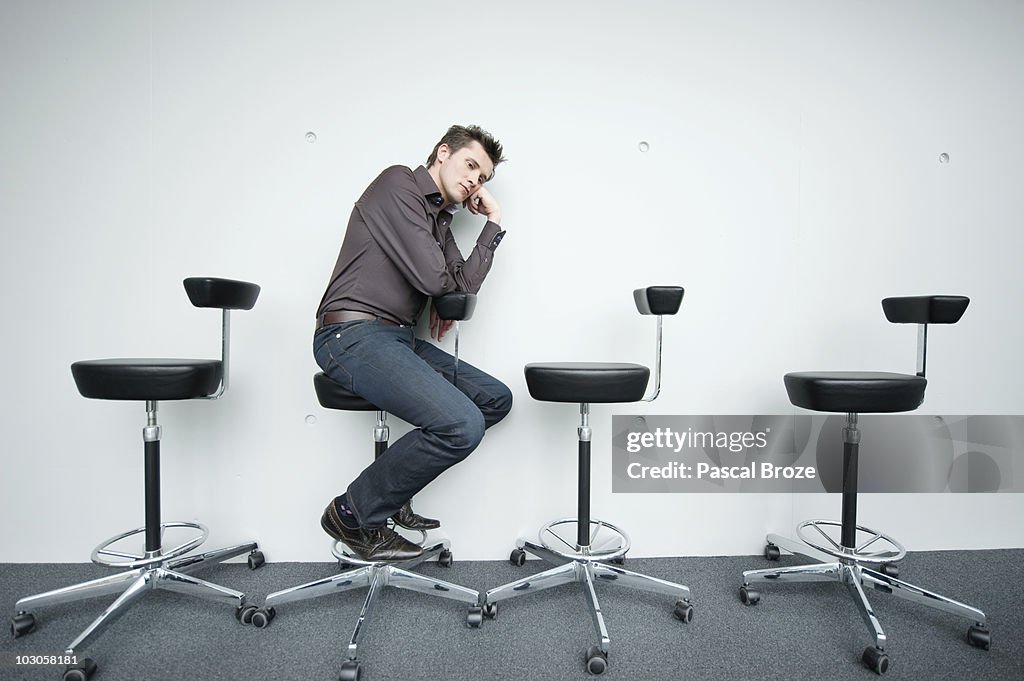 Businessman sitting on a chair and thinking