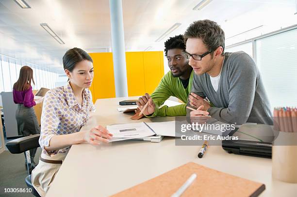 business executives working in an office - african in brussels stock pictures, royalty-free photos & images