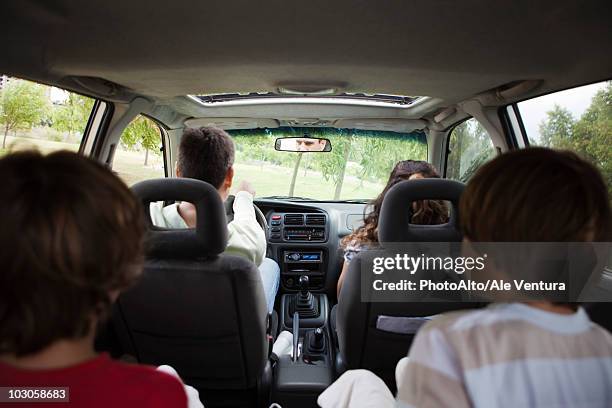 family riding together in car - car and van bildbanksfoton och bilder