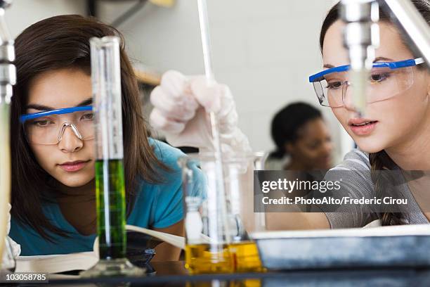 students conducting experiment in chemistry class - science measurement stock pictures, royalty-free photos & images
