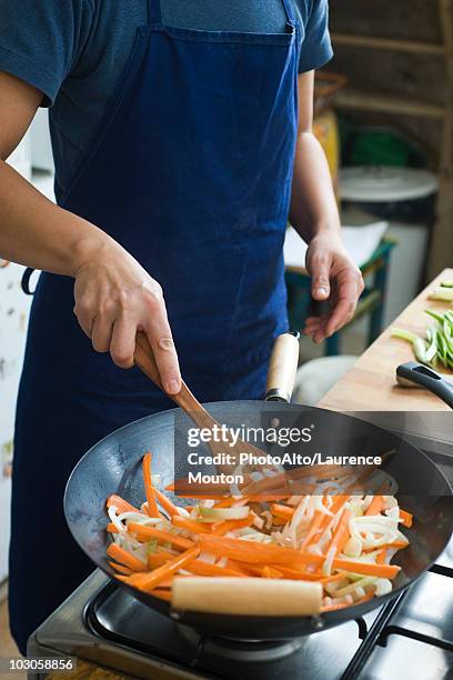 stir-frying vegetables - stir frying european stock pictures, royalty-free photos & images