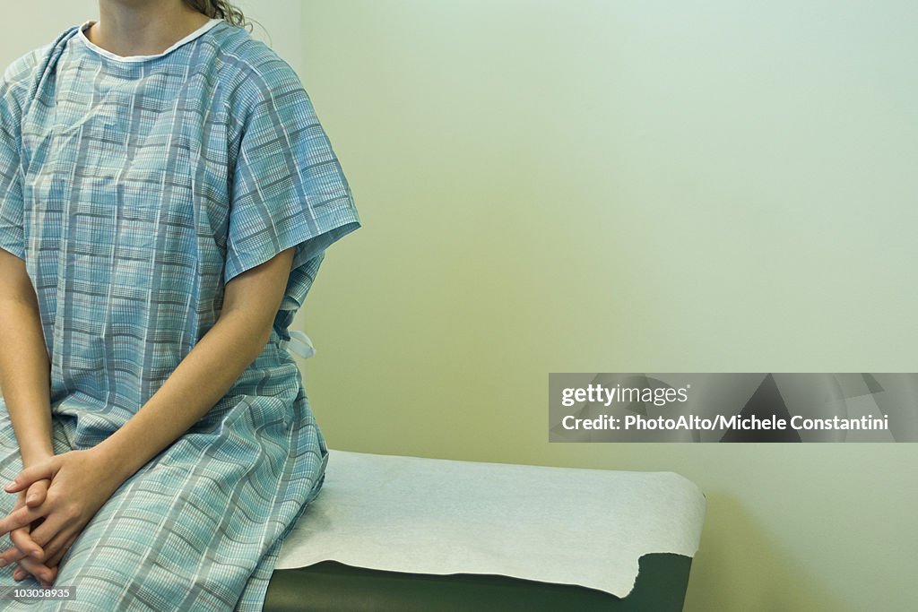 Patient waiting on examination table