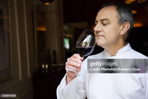 chef appreciating wine bouquet - sommelier stock pictures, royalty-free photos & images