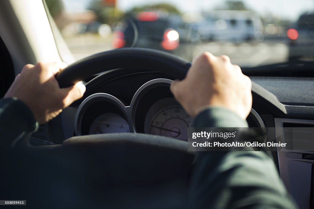 Driving with both hands on the steering wheel
