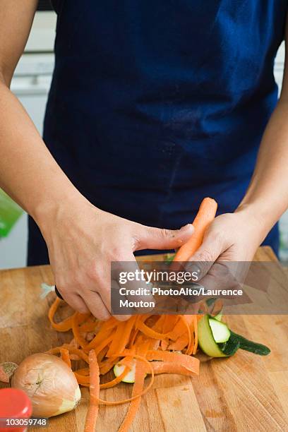 peeling vegetables - peeler stock pictures, royalty-free photos & images