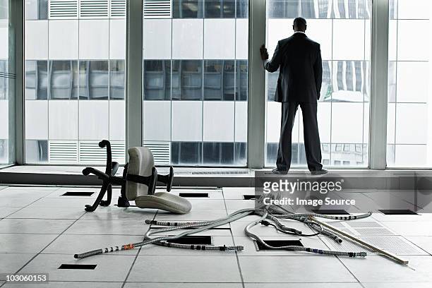 businessman in abandoned office - the end stockfoto's en -beelden