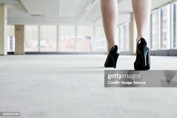 shoes of woman walking in office - business woman high heels stock pictures, royalty-free photos & images