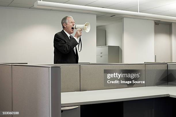 businessman shouting through megaphone - loudspeaker stock pictures, royalty-free photos & images