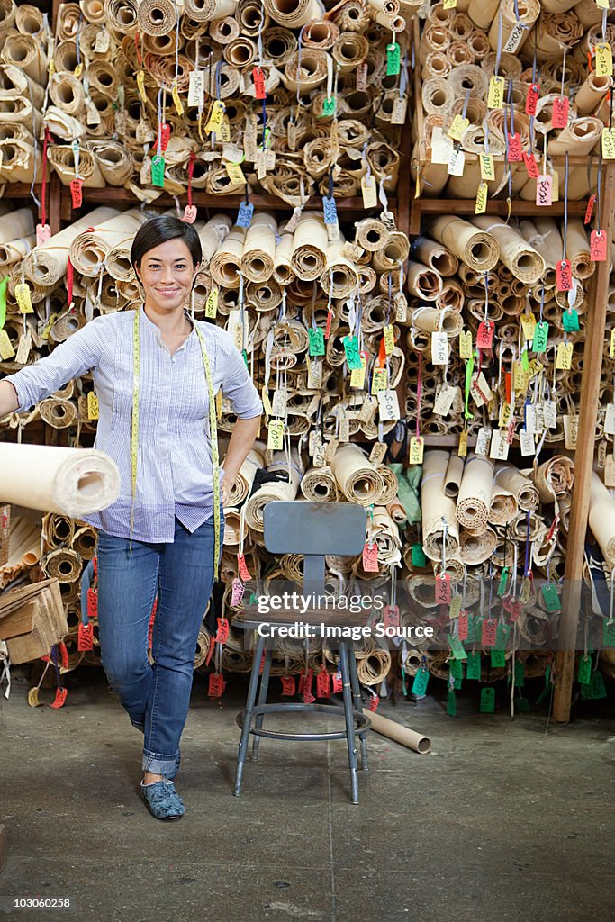 Fashion designer and rolls of patterns