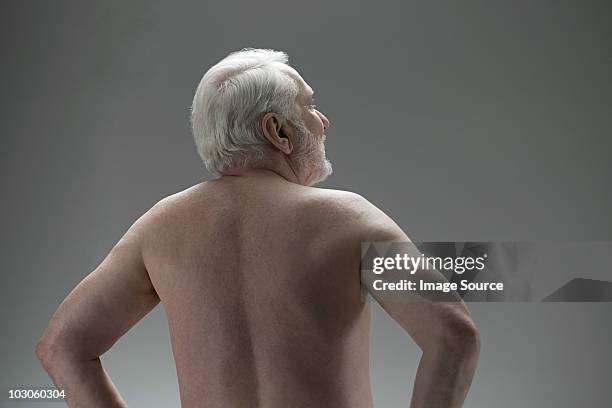 naked senior man, rear view - nudity stock-fotos und bilder