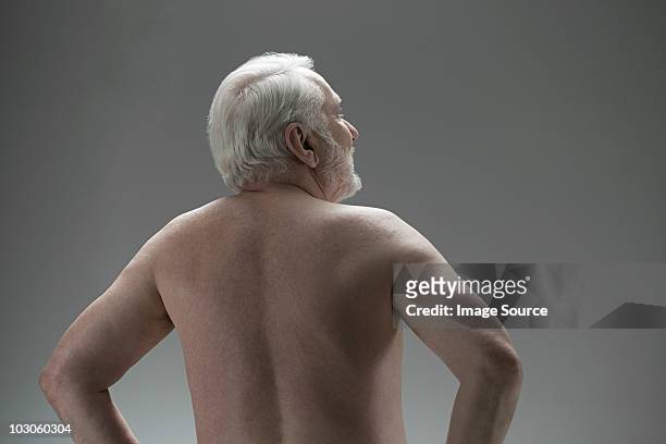 naked senior man, rear view - nudity foto e immagini stock