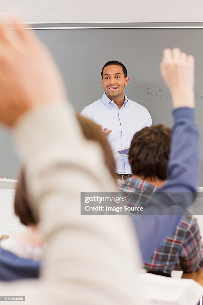 High school students and teacher in classroom