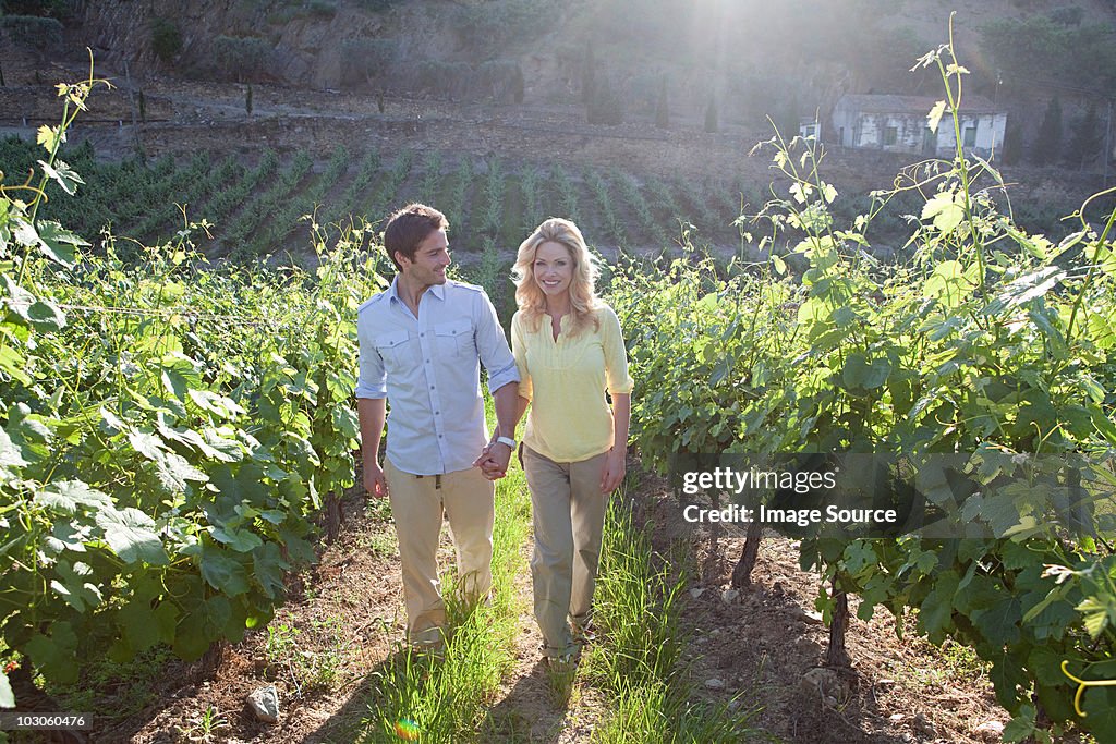 Couple in a sunlit vineyard