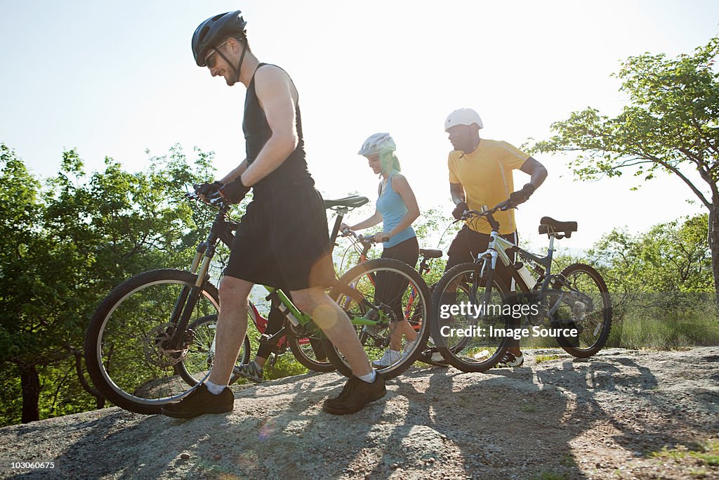 Three cyclists, rural scene