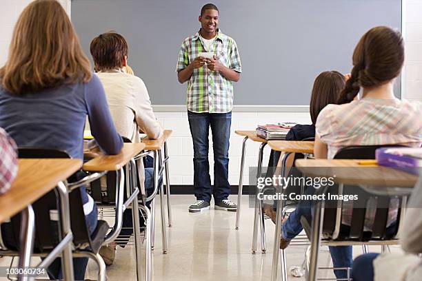 male high school student giving presentation - boy giving speech stock pictures, royalty-free photos & images