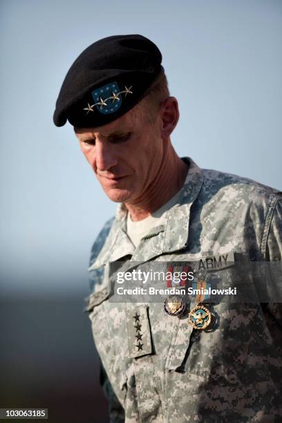 Gen. Stanley McChrystal looks down after receiving the Department of Defense Distinguished Service Medal and the Army Distinguished Service Medal...