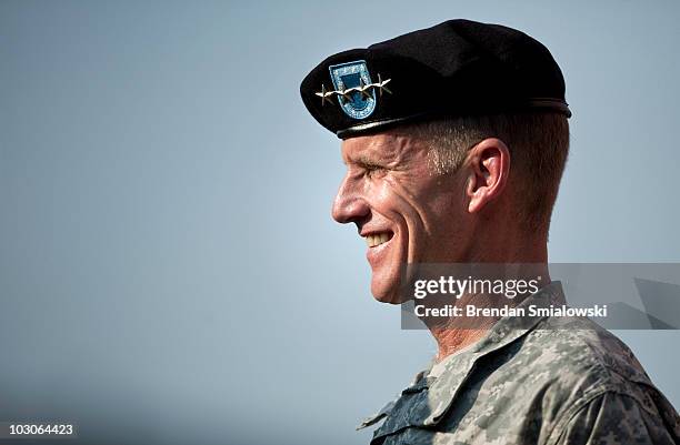 Army Gen. Stanley McChrystal smiles after receiving the Department of Defense Distinguished Service Medal and the Army Distinguished Service Medal...