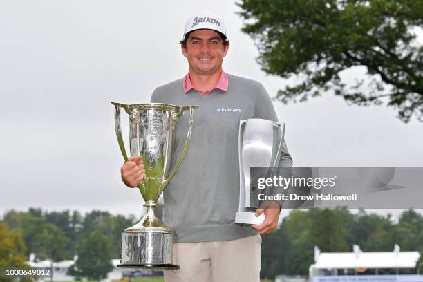 Keegan Bradley holds the championship trophy and the Wadley Cup after winning the BMW Championship at Aronimink Golf Club on September 10, 2018 in...