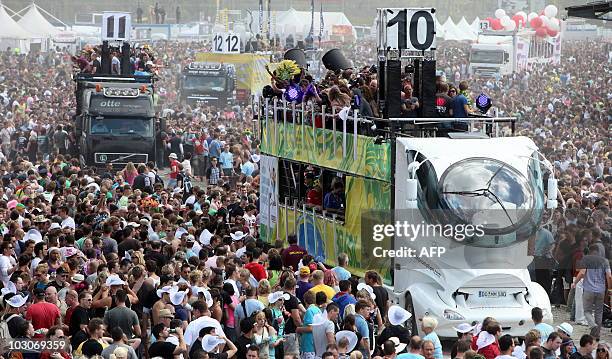 Participants of the Loveparade 2010 dance at the festival in Duisburg, western Germany, on July 24, 2010. The annual techno music event is expected...