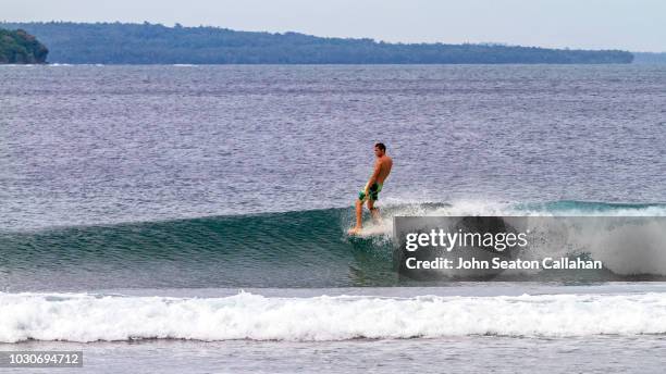 the philippines, surfing in mindanao - surf tube stock pictures, royalty-free photos & images