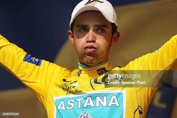 Race leader Alberto Contador of team Astana stands on the podium in the yellow jersey following stage 19 of the Tour de France on July 24, 2010 in...