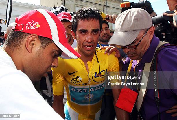 Alberto Contador of Spain and the Astana Team makes his way to the podium after stage nineteen, a 52km individual time trial from Bordeaux to...