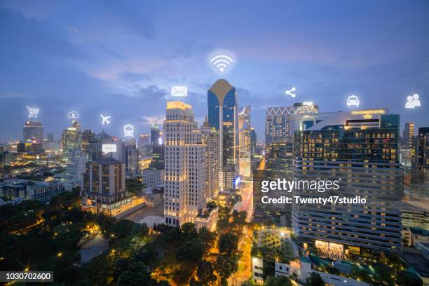 technology and communication network in city concept. technology and media icon over city. - australia media access stock pictures, royalty-free photos & images