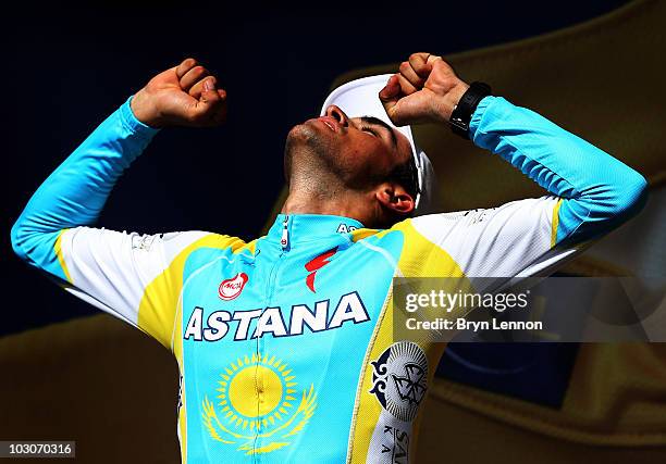 Alberto Contador of Spain and the Astana Team reacts on the podium after retaining his yellow jersey on stage nineteen, a 52km individual time trial...