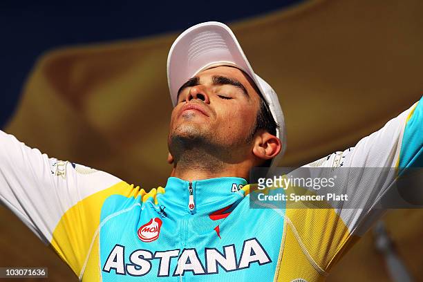 Race leader Alberto Contador of team Astana stands on the podium following stage 19 of the Tour de France on July 24, 2010 in Pauillac, France. The...