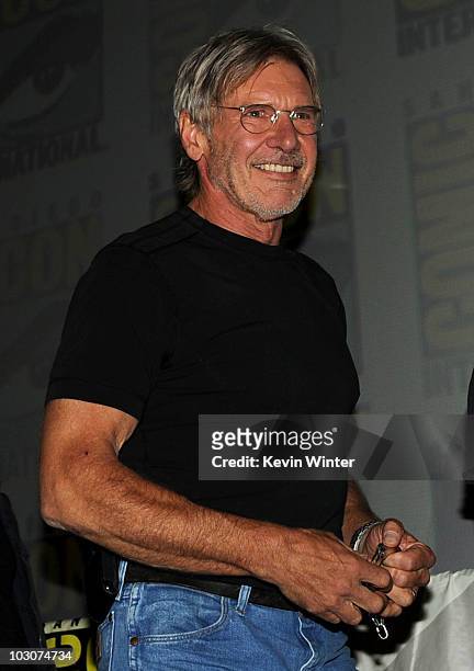 Actor Harrison Ford walks onstage at the "Cowboys & Aliens" panel discussion during Comic-Con 2010 at San Diego Convention Center on July 24, 2010 in...