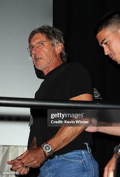 Actor Harrison Ford walks onstage at the "Cowboys & Aliens" panel discussion during Comic-Con 2010 at San Diego Convention Center on July 24, 2010 in...