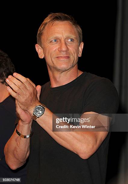 Actor Daniel Craig walks onstage at the "Cowboys & Aliens" panel discussion during Comic-Con 2010 at San Diego Convention Center on July 24, 2010 in...