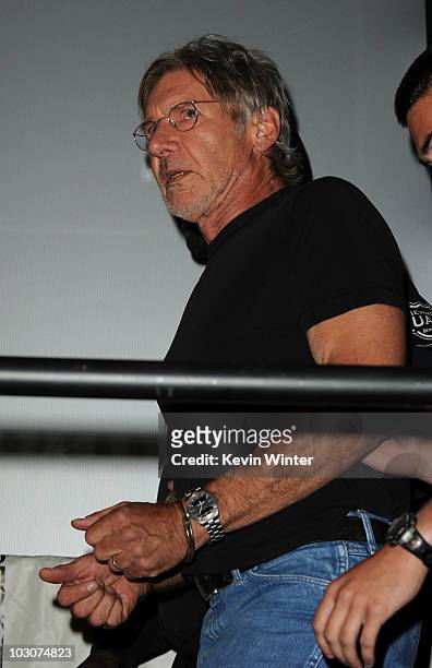 Actor Harrison Ford walks onstage at the "Cowboys & Aliens" panel discussion during Comic-Con 2010 at San Diego Convention Center on July 24, 2010 in...