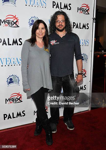 Professonal poker player Annie Duke and actor Joe Reitman arrive at the Annual Shawn Marion Foundation Poker Tournament at The Palms Casino Resort on...