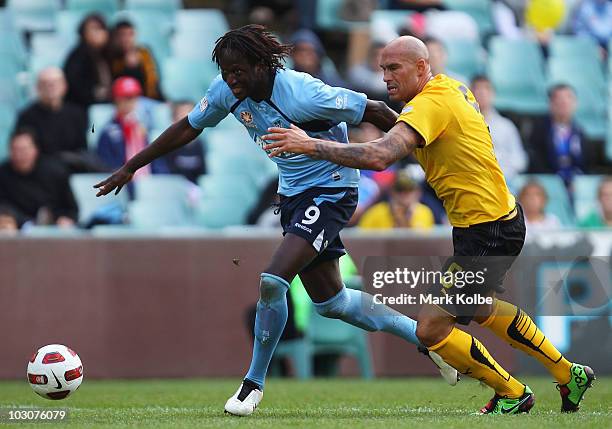 Ibrahima Thiam of Sydney FC competes for the ball against Daniel Majstorovic of the AEK Athens FC during the pre-season friendly match between Sydney...