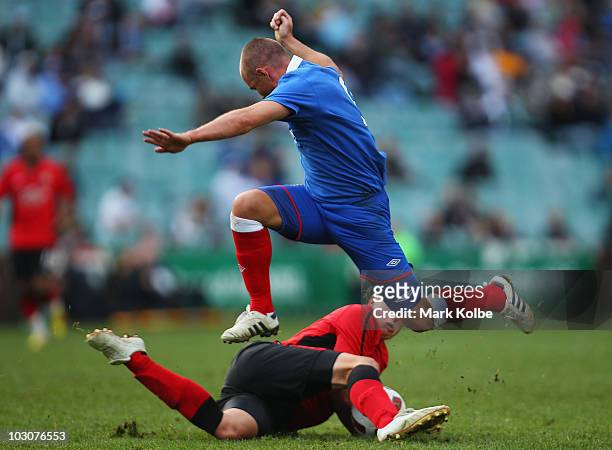 Kenny Miller of Rangers is tackled during the pre-season friendly match between Blackburn Rovers and Glasgow Rangers at the Sydney Football Stadium...