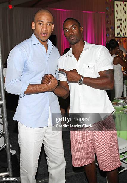 Players Dahnty Jones and Ben Gordon attend the Art For Life East Hampton 11th Annual Benefit at Russell Simmons' East Hampton Estate on July 24, 2010...