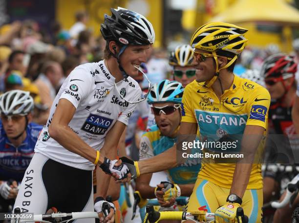 Andy Schleck of team Saxo Bank congratulates Alberto Contador of team Astana at the start of the twentieth and final stage of Le Tour de France 2010,...