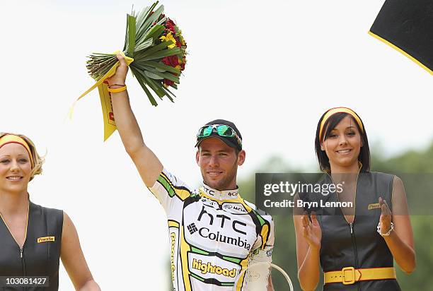 Mark Cavendish of team HTC Columbia celebrates on the podium after winning the twentieth and final stage of Le Tour de France 2010, from Longjumeau...