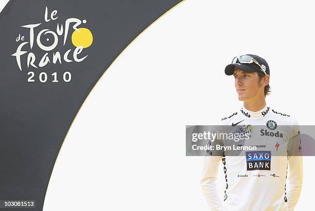 Andy Schleck of team Saxo Bank looks on as he stands on the podium wearing the young riders jersey after the twentieth and final stage of Le Tour de...