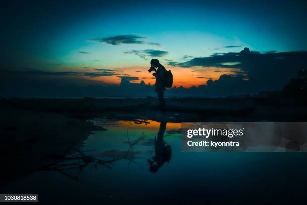 one man and magic hour - cameraman stock pictures, royalty-free photos & images