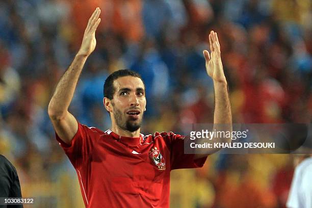 Egyptian player Mohammed Abou Trika of al-Ahli club celebratex scoring the winning goal against Haras al-Hodud club during their Super Cup match in...