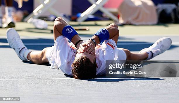 Mardy Fish lies on the court celebrating his win over John Isner in the finals of the Atlanta Tennis Championships at the Atlanta Athletic Club on...