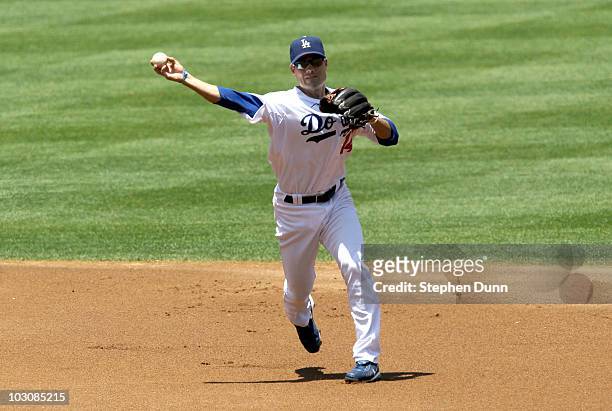 Shortstop Jamey Carroll of the Los Angeles Dodgers throws out Jose Reyes of the New York Mets in the first inning on July 25, 2010 at Dodger Stadium...