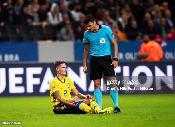 Mikael Lustig of Sweden in pain during the UEFA Nations League B group two match between Sweden and Turkey on September 10, 2018 at Friends Arena in...