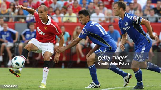 Gabriel Obertan of Manchester United clashes with Roger Espinoza of Kansas City Wizards during the pre-season friendly match between Kansas City...