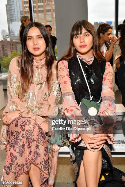 Dylana Lim Suarez and Natalie Lim Suarez attend the Libertine front row during New York Fashion Week: The Shows at Gallery II at Spring Studios on...