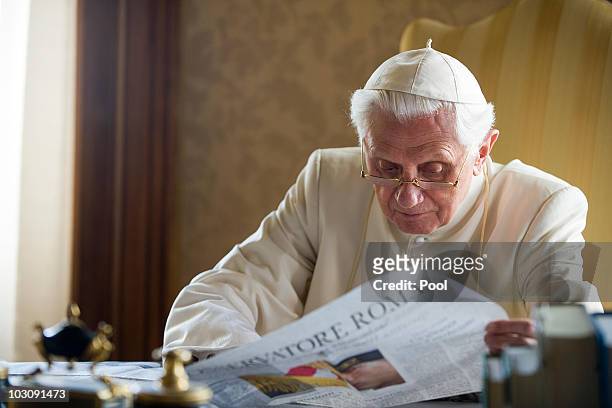 Pope Benedict XVI reads papers in his summer residence on July 26, 2010 in Castel Gandolfo, near Rome, Italy. The Pontiff will visit England from...