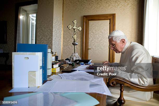 Pope Benedict XVI reads in his summer residence on July 26, 2010 in Castel Gandolfo, near Rome, Italy. The Pontiff will visit England from September...